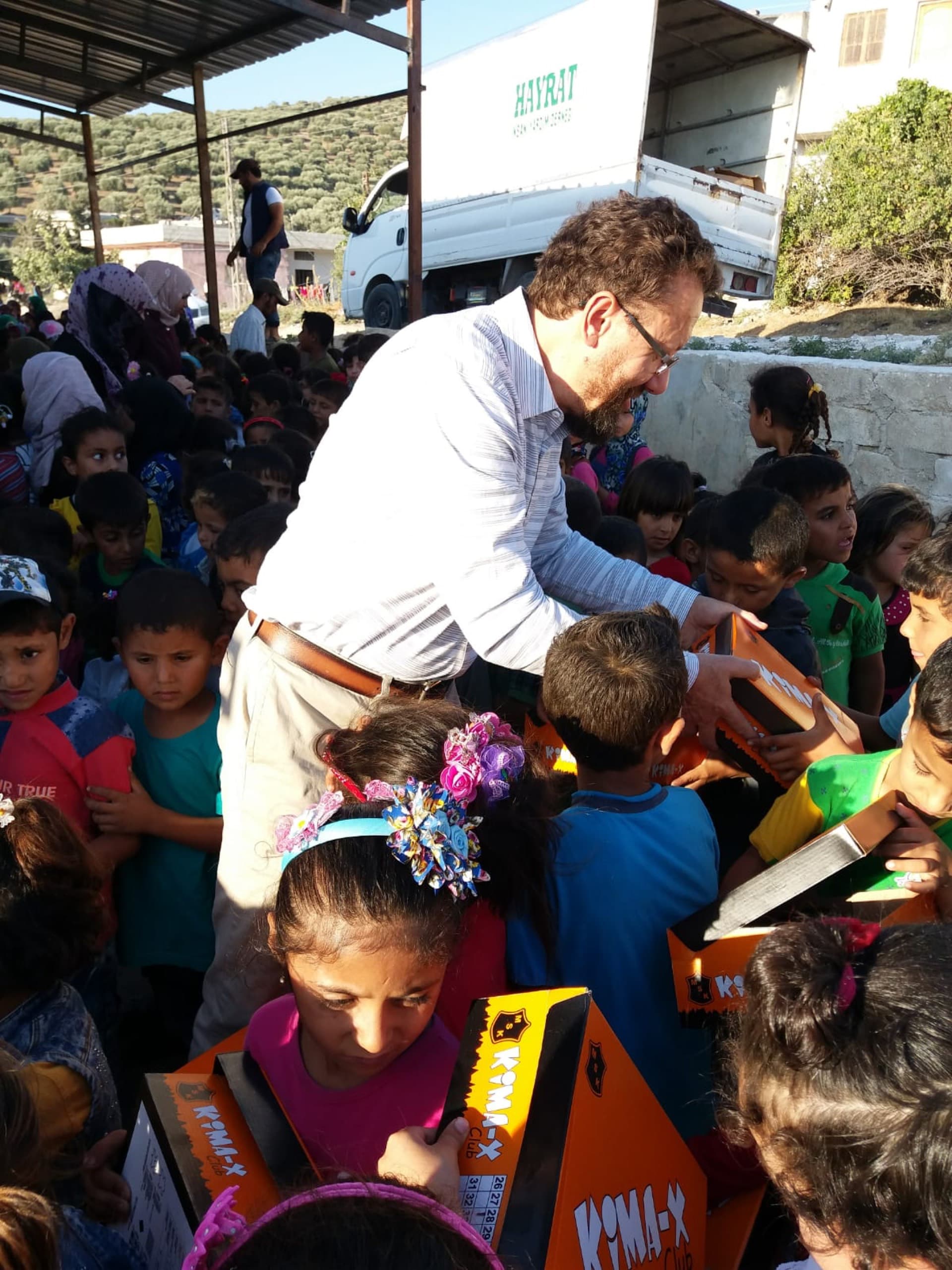 Dr. Witta distributing supplies to children in Syria